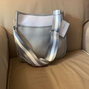 Neoprene purse with guitar strap